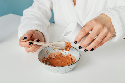 How to Treat Age Spots Naturally Pouring Water on Spoonful of Cream